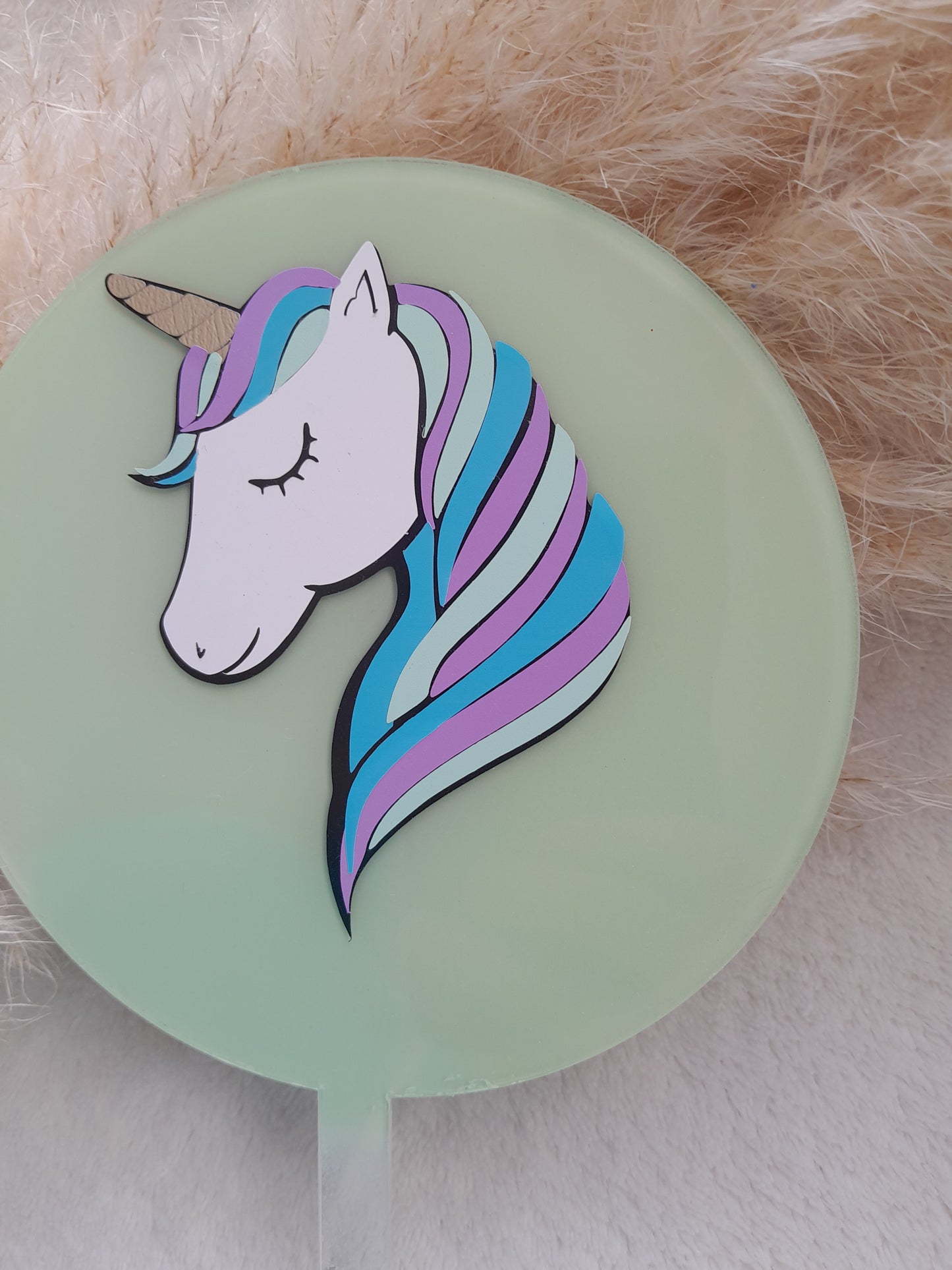 Acrylic cake topper with sage green background and unicorn 